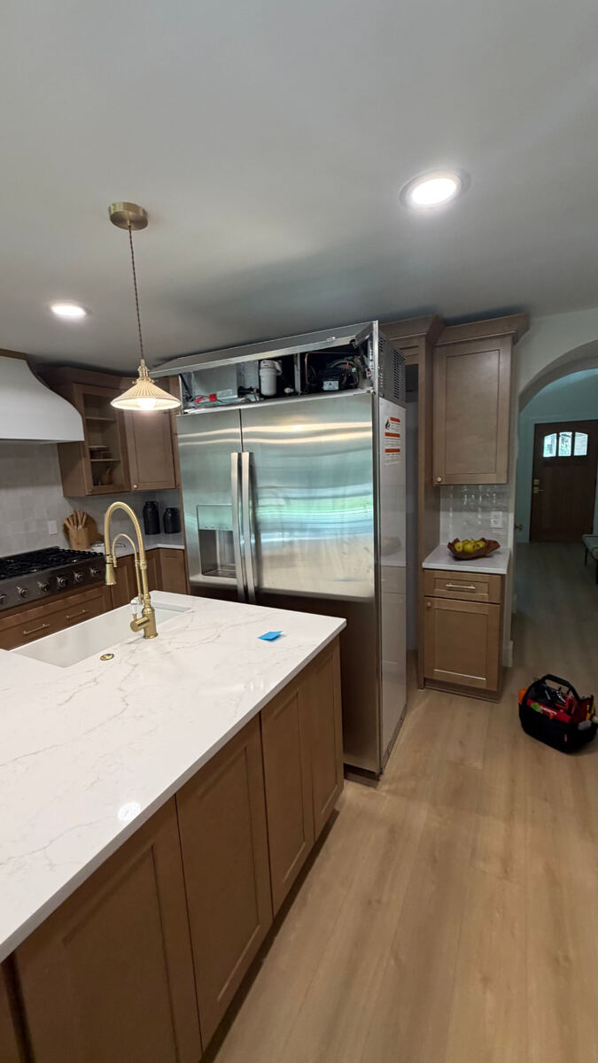 Refrigerator repair technician service call in a Fort Worth TX kitchen