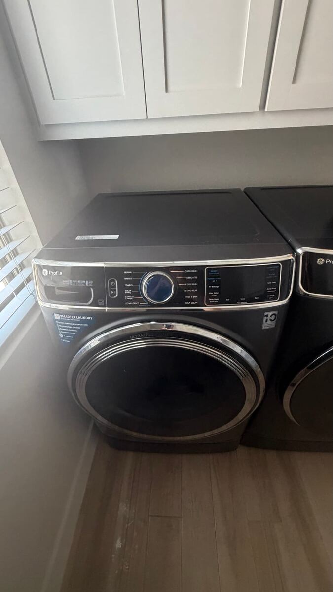 Washing machine repair service in a Fort Worth TX laundry room